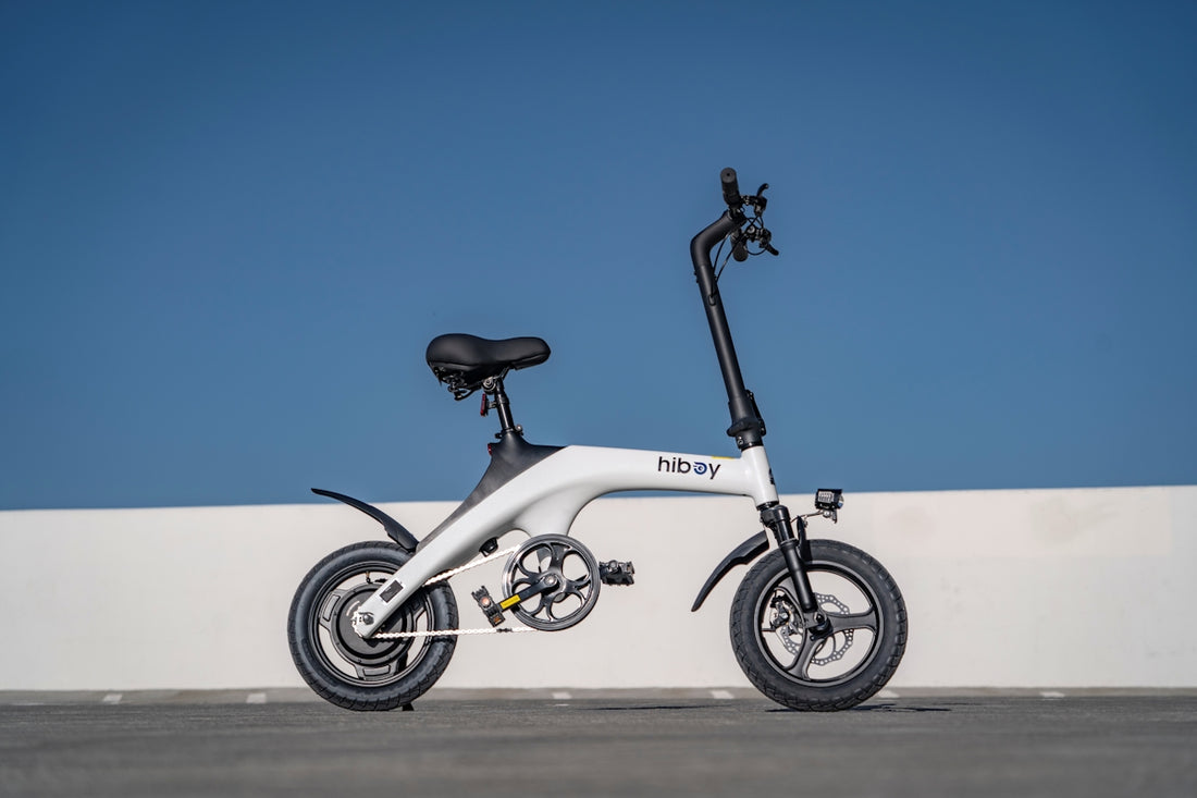 An electric scooter parked on the side of the road